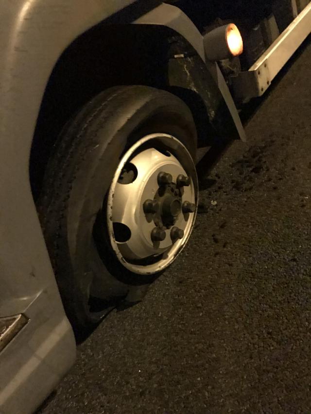 A photo of the flat tire on the HGV.