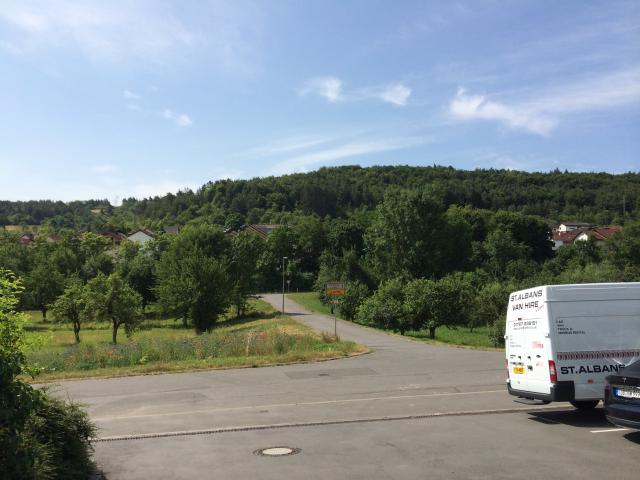 The fields and forest viewed from the front of the hotel.